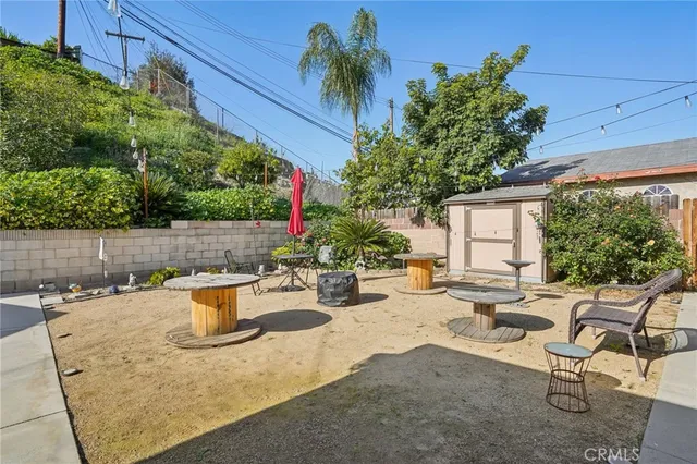 a view of a backyard with sitting area