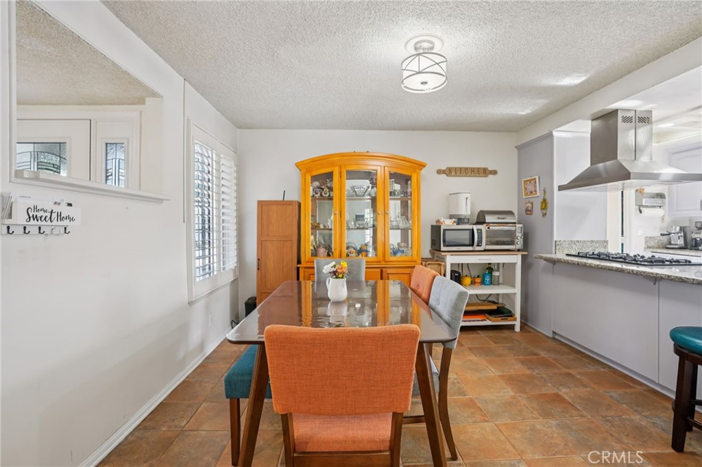 215 South Rock River Road Diamond Bar, CA 91765 - Photo 4 of 32 a dining room with furniture and a large window