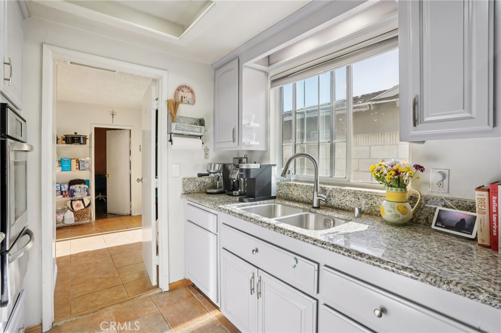 215 South Rock River Road Diamond Bar, CA 91765 - Photo 10 of 32 a kitchen with sink and cabinets