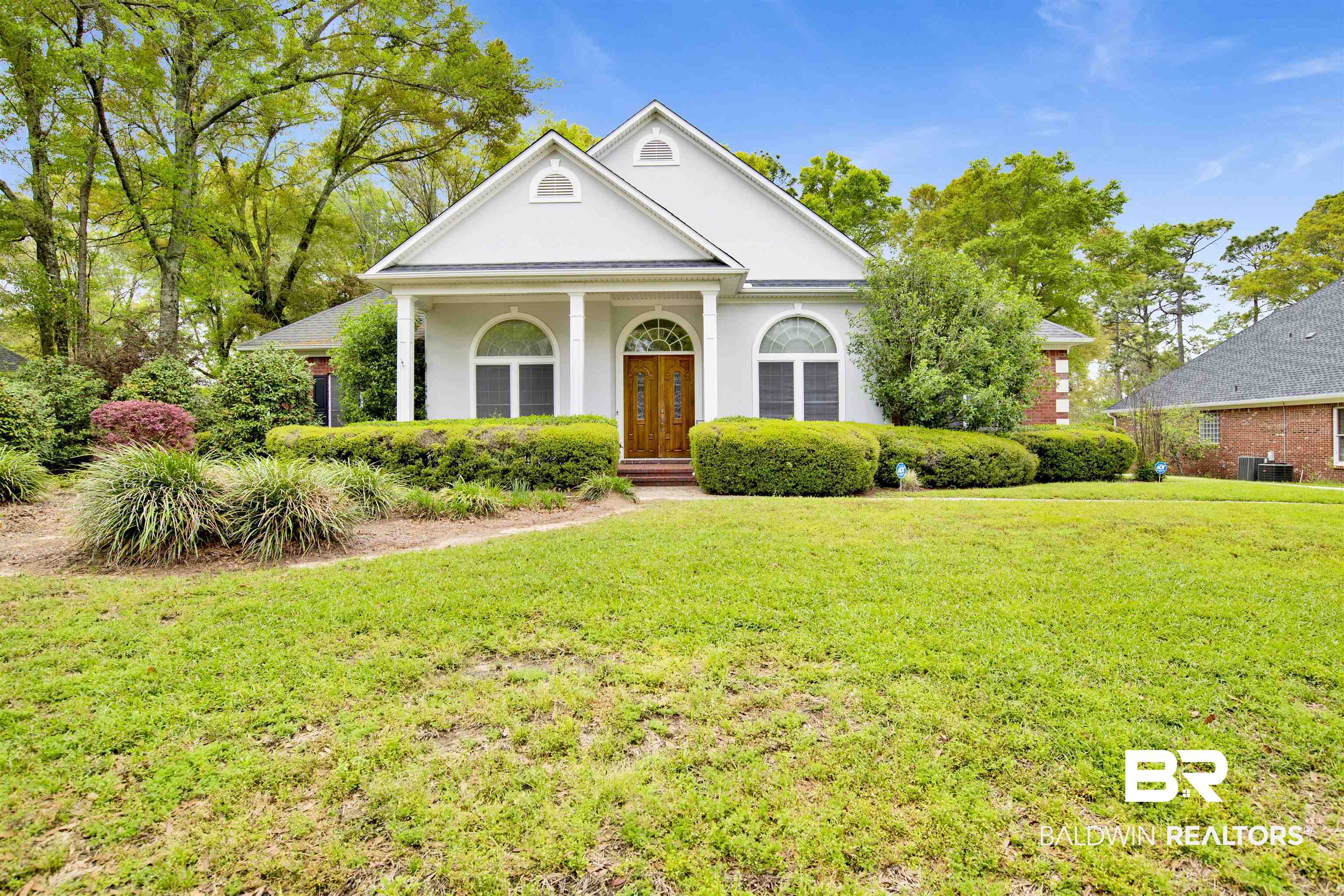 106 Old Mill Road Fairhope, AL 36532 - Photo 1 of 49 Greek revival inspired property with stucco siding, a front lawn, and central AC
