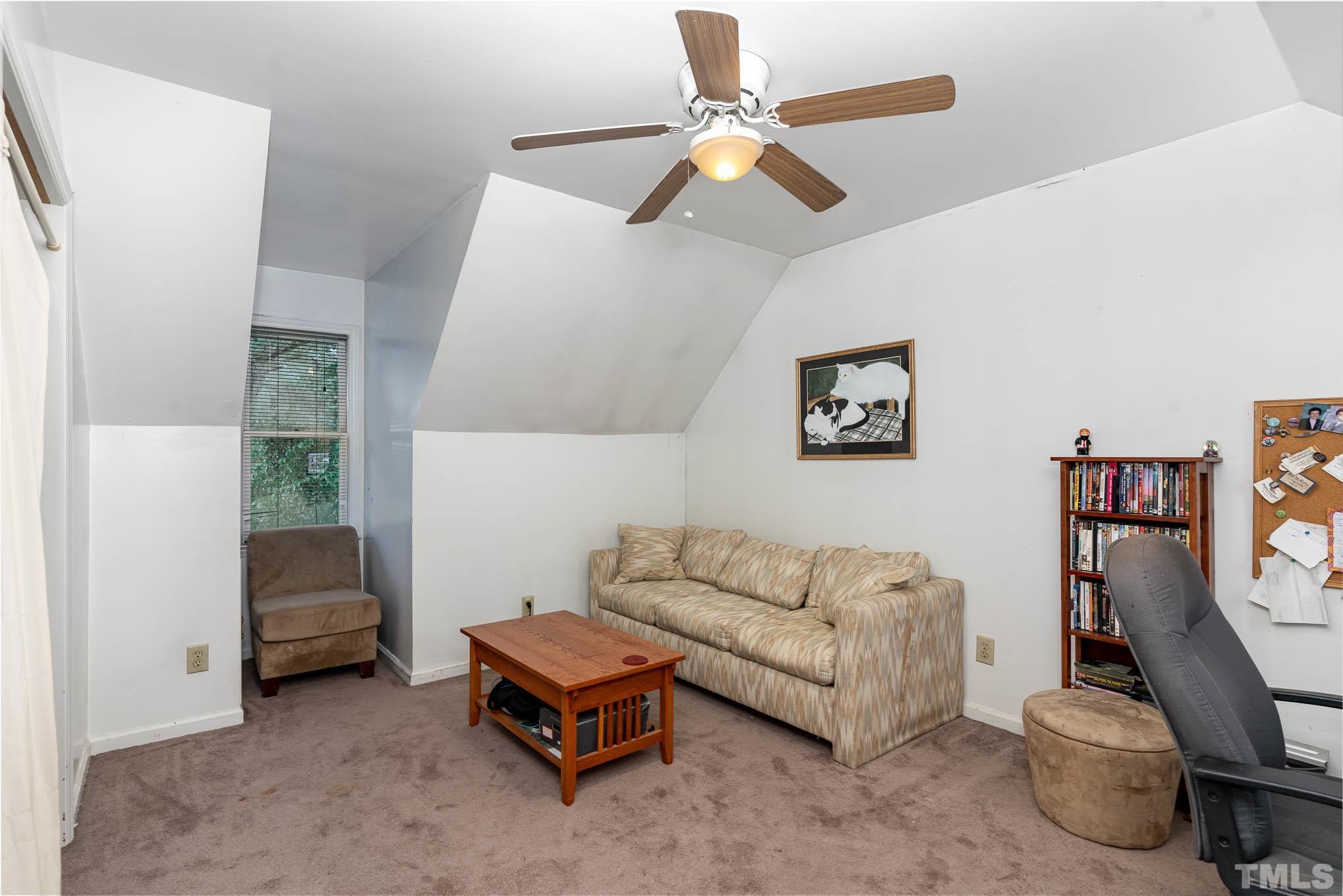 3233 Banks Road Raleigh, NC 27603 - Photo 20 of 27 a living room with furniture and a chair