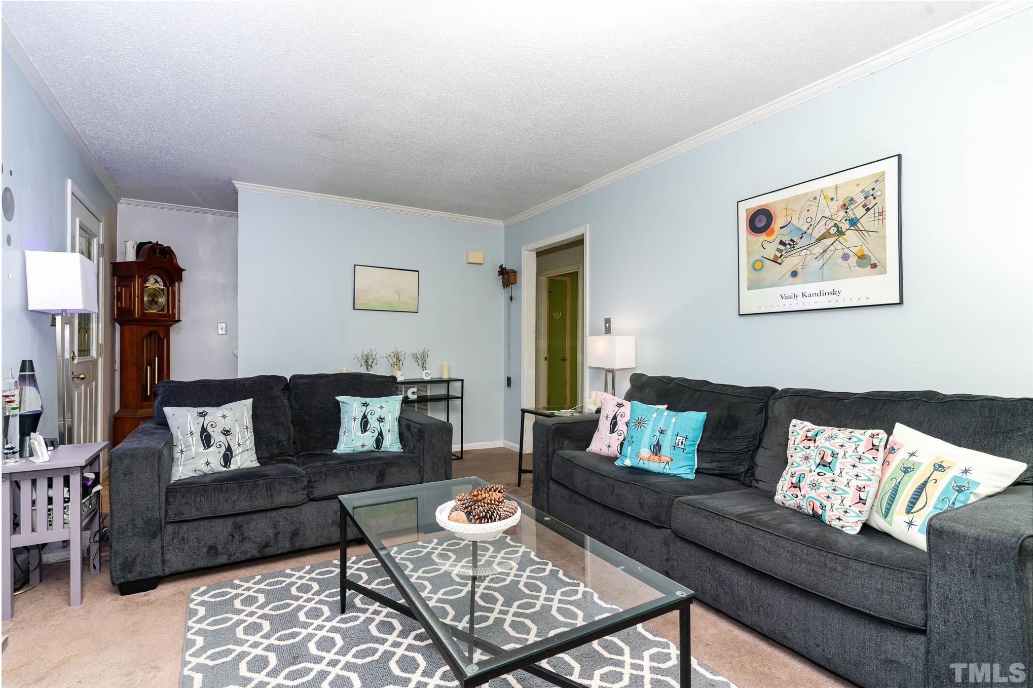 3233 Banks Road Raleigh, NC 27603 - Photo 7 of 27 a living room with furniture and a couch