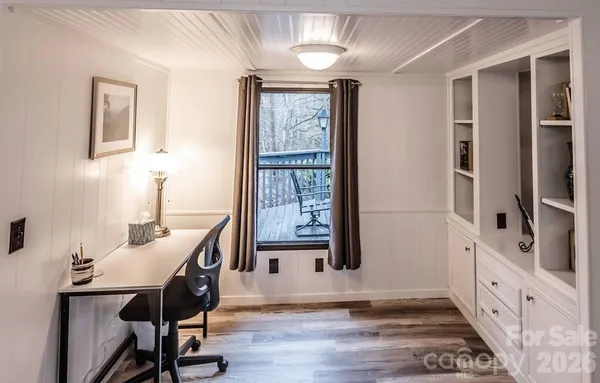 a view of a livingroom with furniture window and wooden floor