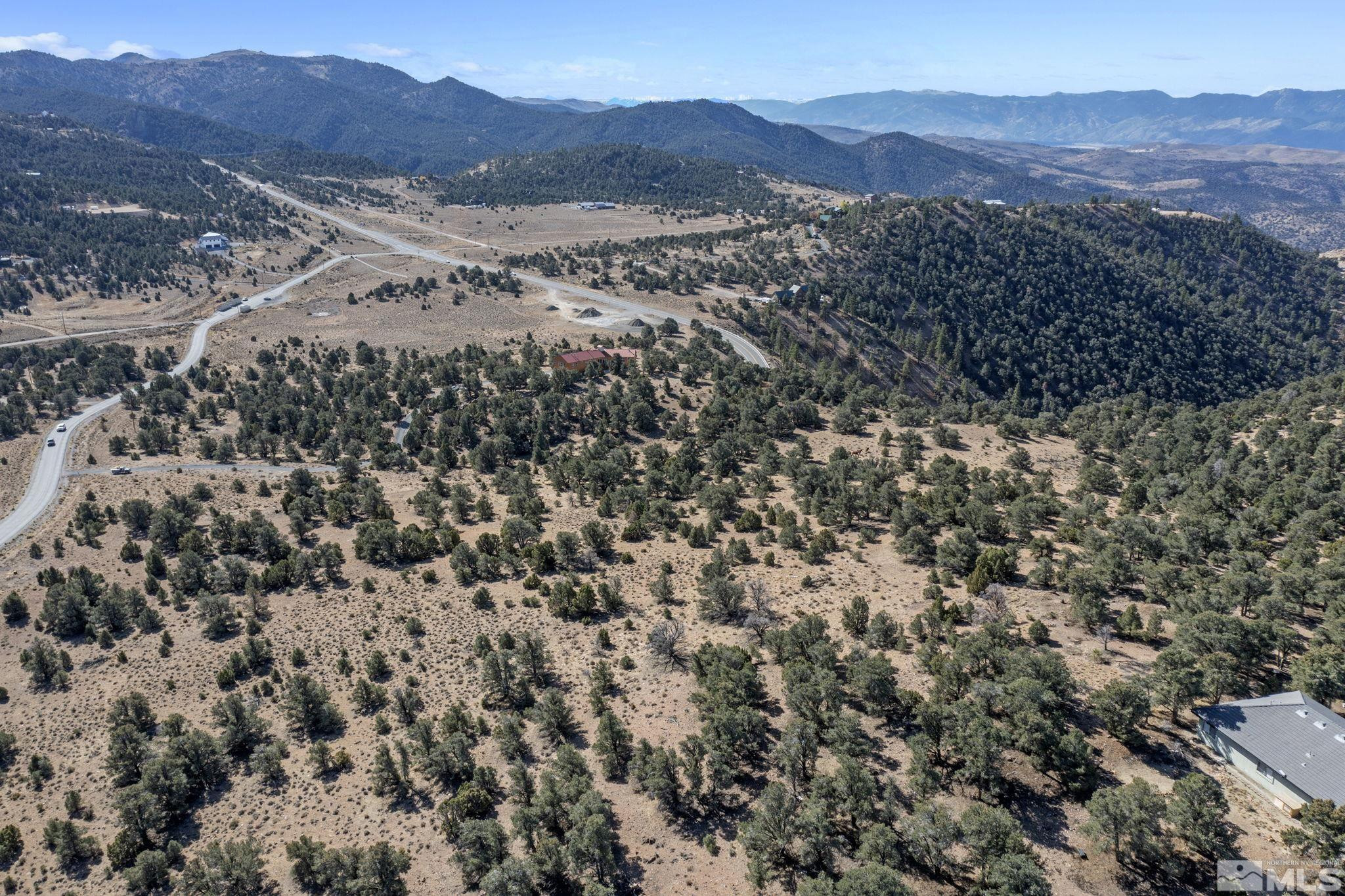 740 Cartwright Road Reno, NV 89521 - Photo 2 of 12 a view of a lush green hillside and a mountain