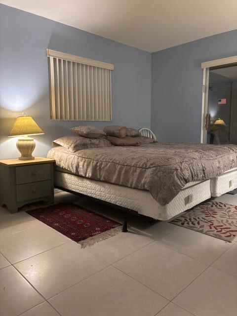 669 Saxony Place Delray Beach, FL 33446 - Photo 5 of 20 a bedroom with a bed and window