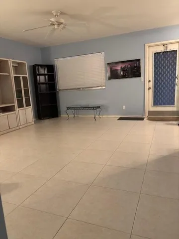 a view of a livingroom with furniture and storage