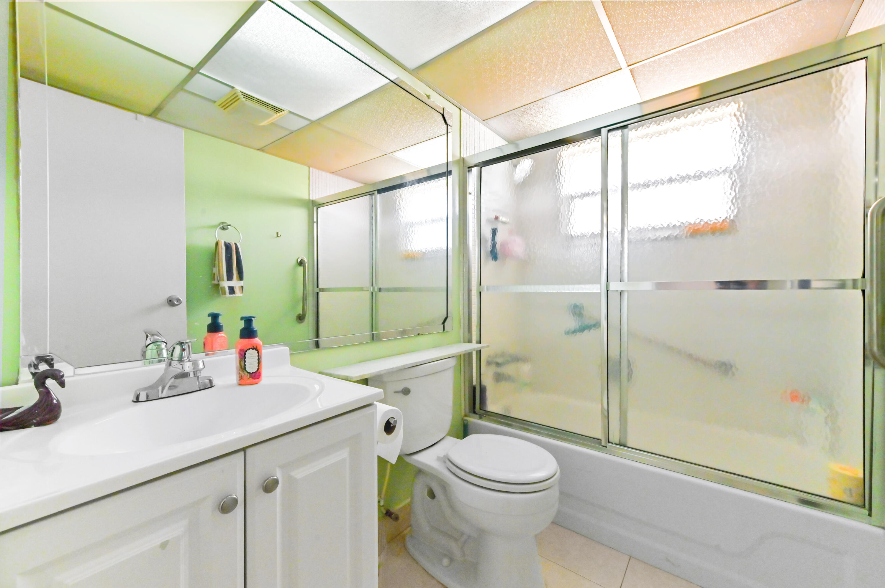 669 Saxony Place Delray Beach, FL 33446 - Photo 9 of 20 a bathroom with a sink a toilet and shower