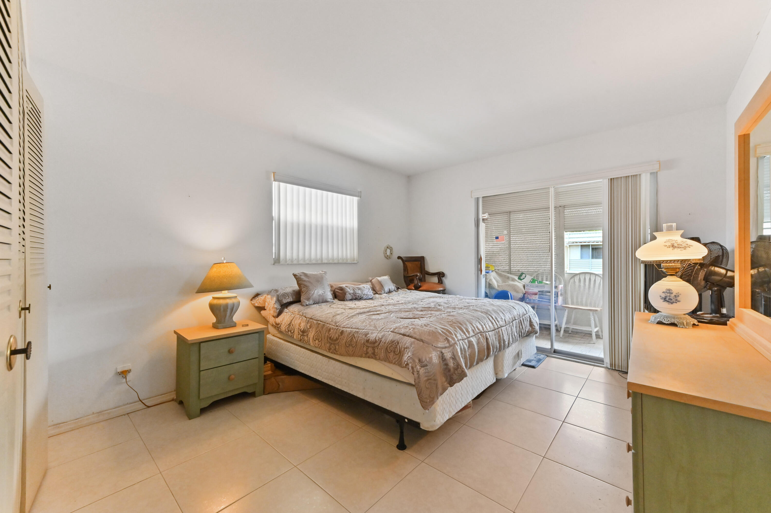 669 Saxony Place Delray Beach, FL 33446 - Photo 10 of 20 a bedroom with a bed and window