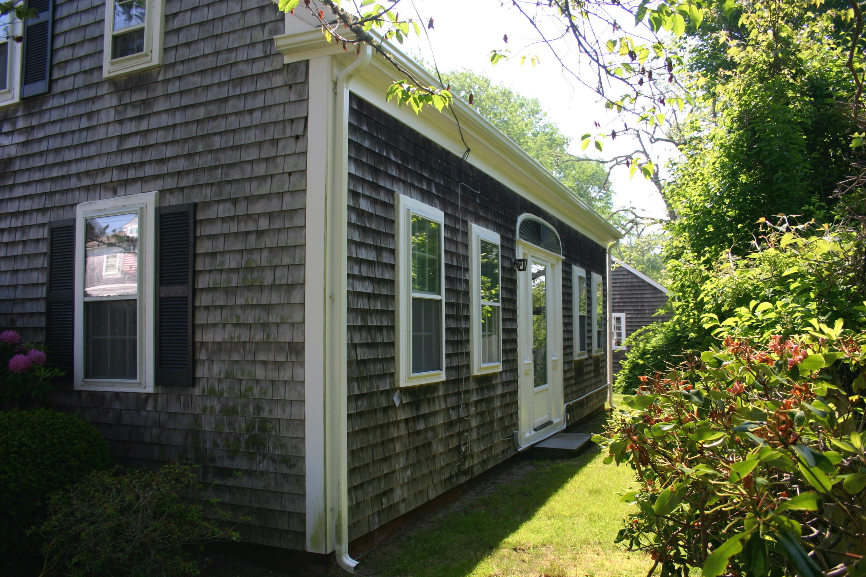 90 Old Harbor Road Chatham, MA 02633 - Photo 2 of 9 a view of a porch with a tree