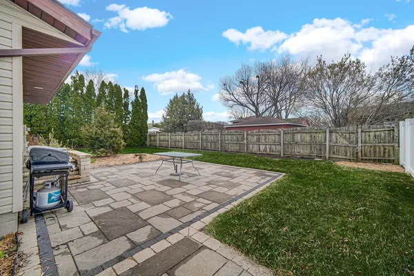 a view of a backyard with pathway