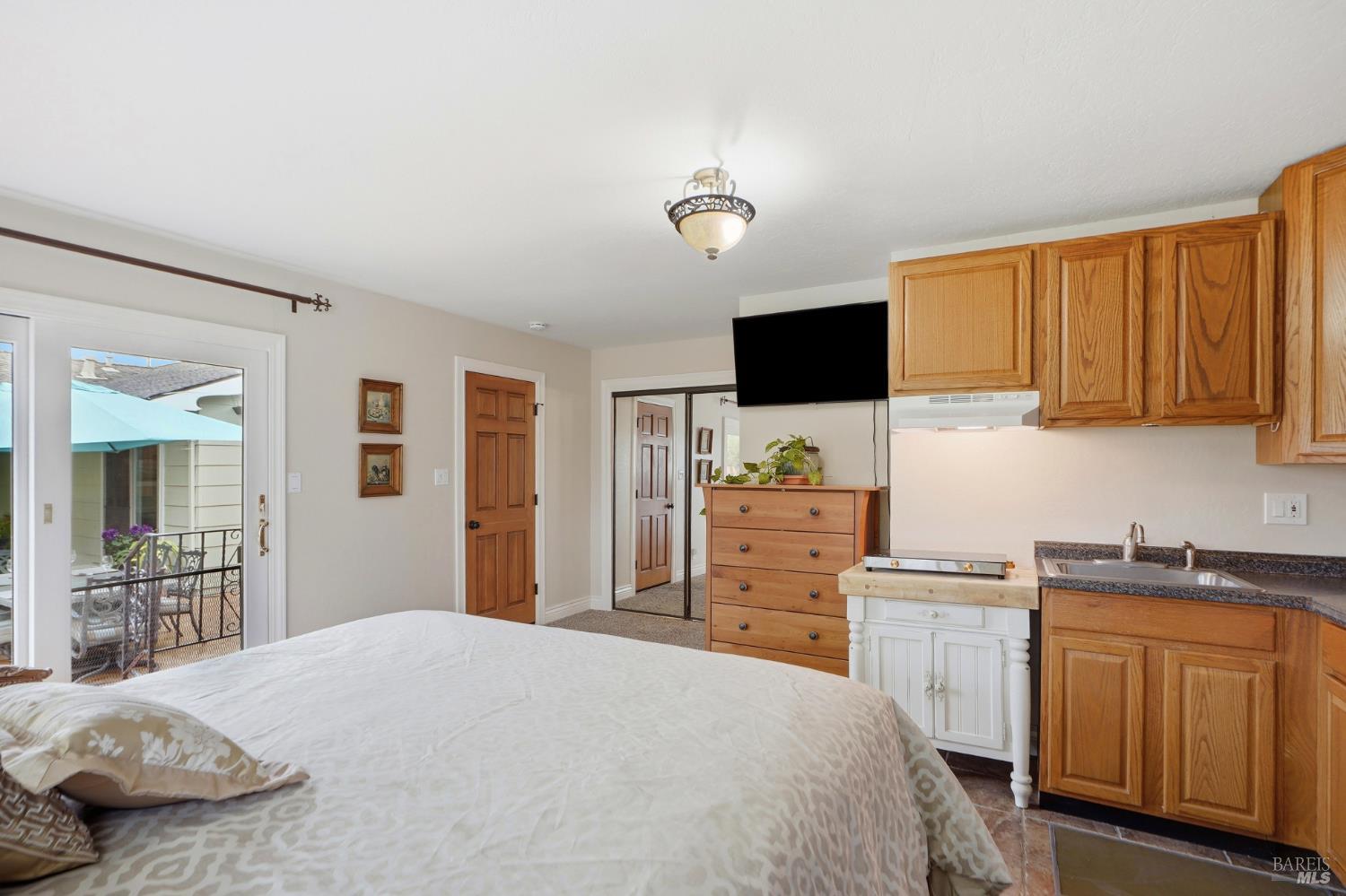 373 Piezzi Road Santa Rosa, CA 95401 - Photo 30 of 55 a bedroom with a bed and cabinets