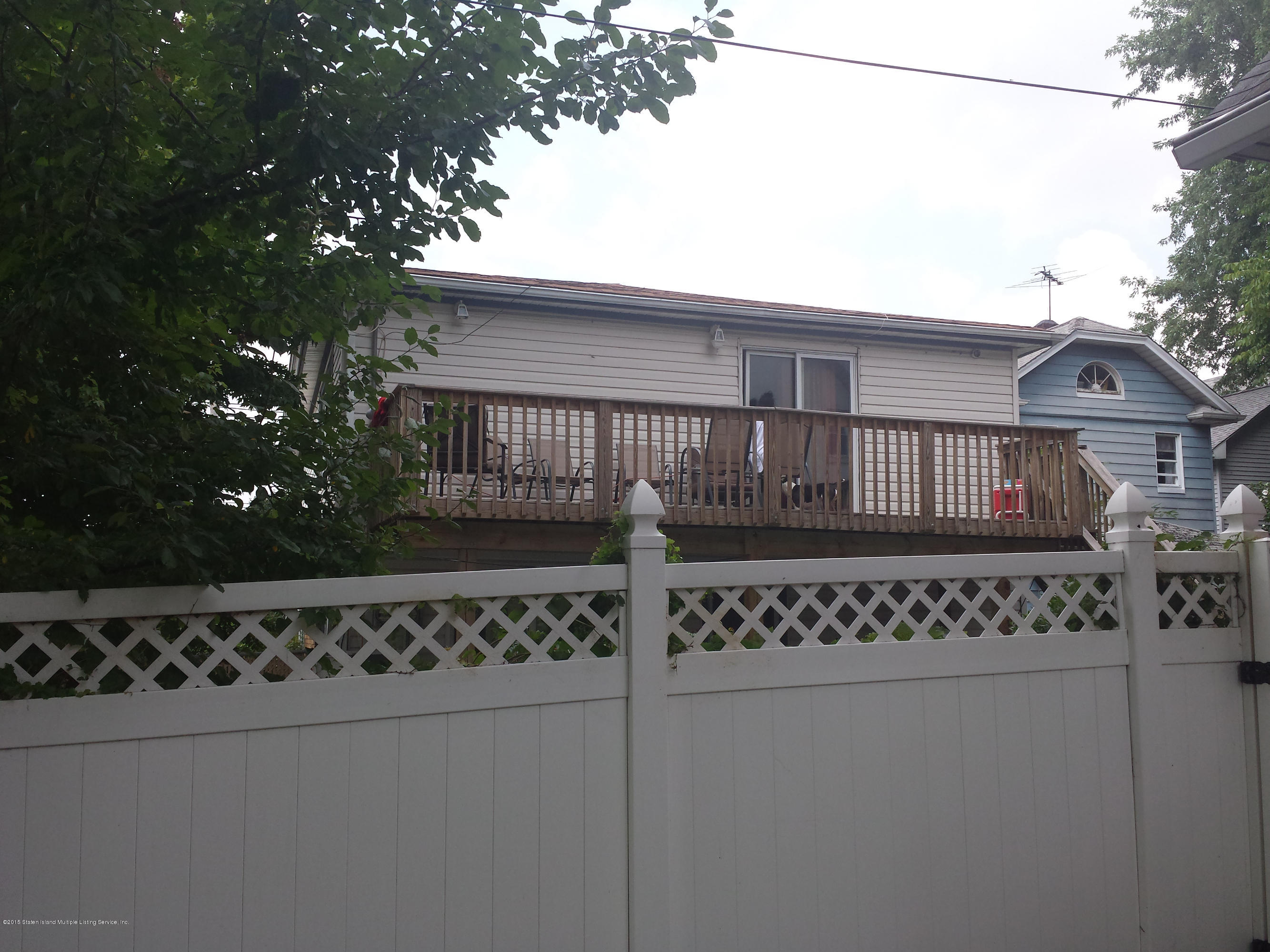 9 Manor Road Staten Island, NY 10310 - Photo 2 of 6 a view of a house with a wooden fence