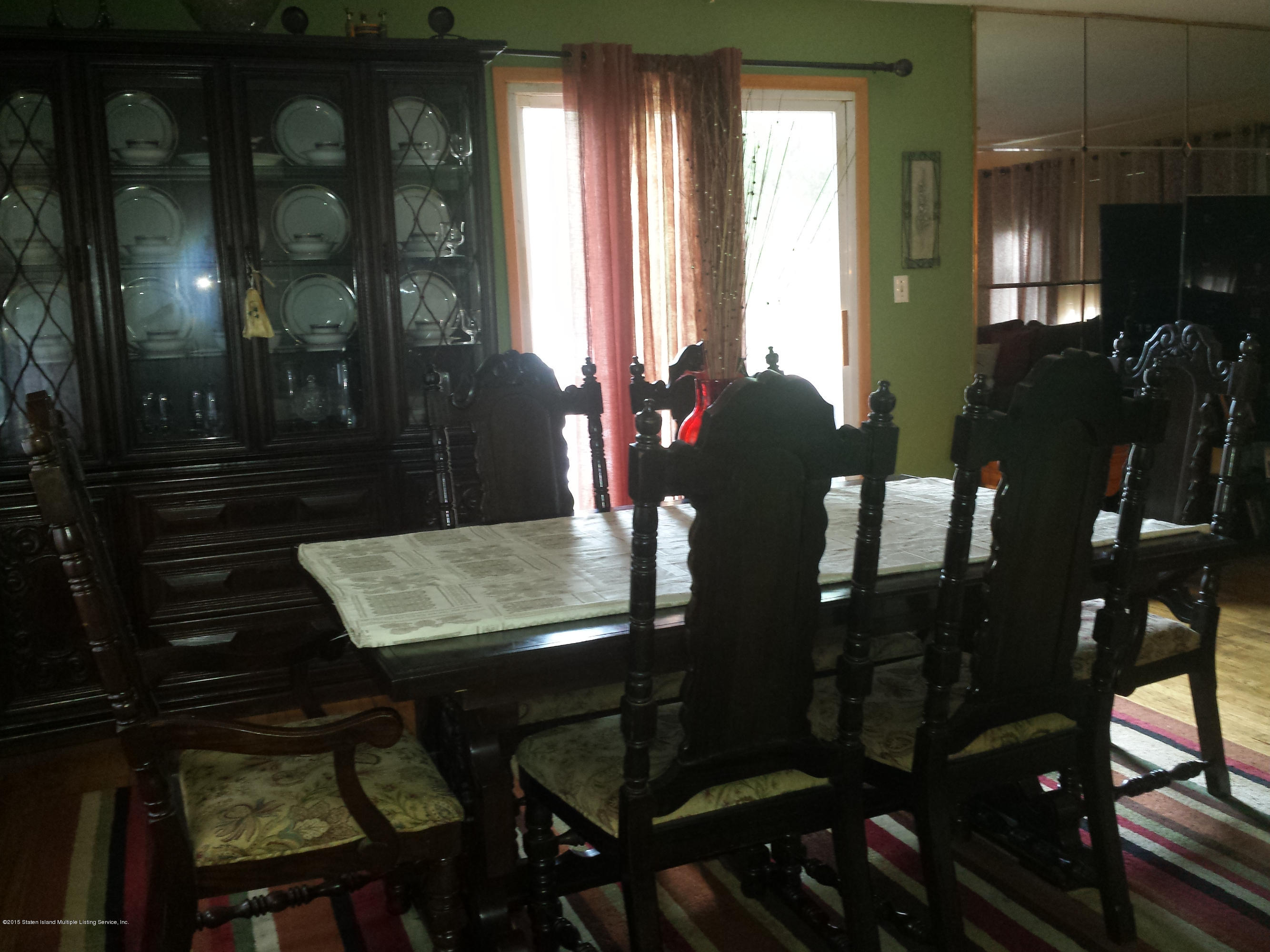 9 Manor Road Staten Island, NY 10310 - Photo 4 of 6 a view of a dining room with furniture and window
