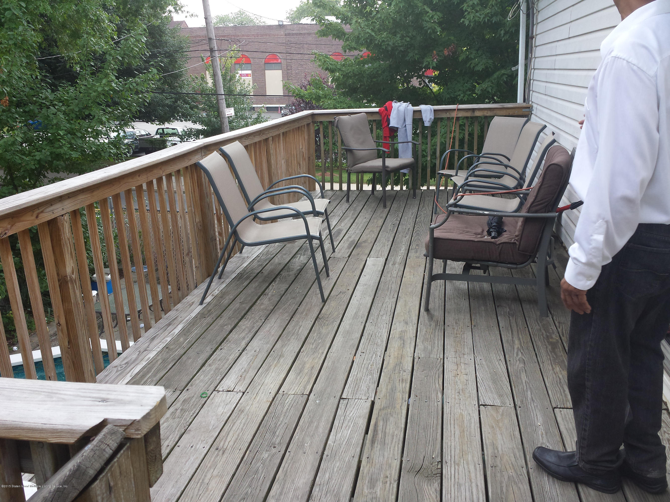 9 Manor Road Staten Island, NY 10310 - Photo 5 of 6 a view of a deck with wooden floor and outdoor seating