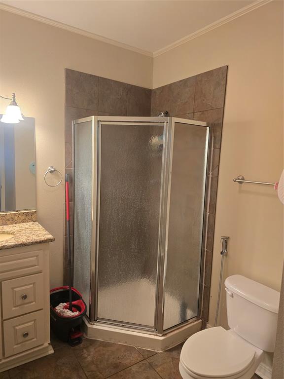 206 Summit Street Minden, LA 71055 - Photo 19 of 23 a bathroom with a granite countertop toilet sink and shower