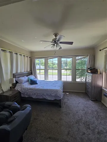 a bedroom with furniture and window
