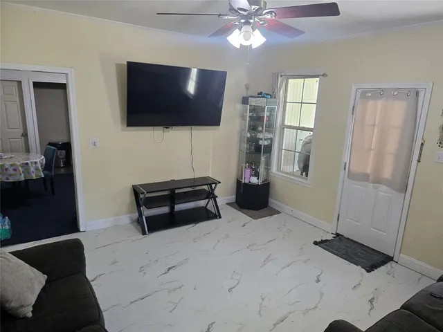 a bedroom with furniture and window