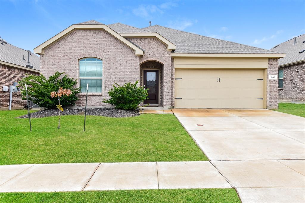 1208 Mesquite Lane Princeton, TX 75407 - Photo 1 of 17 a front view of a house with a yard and garage