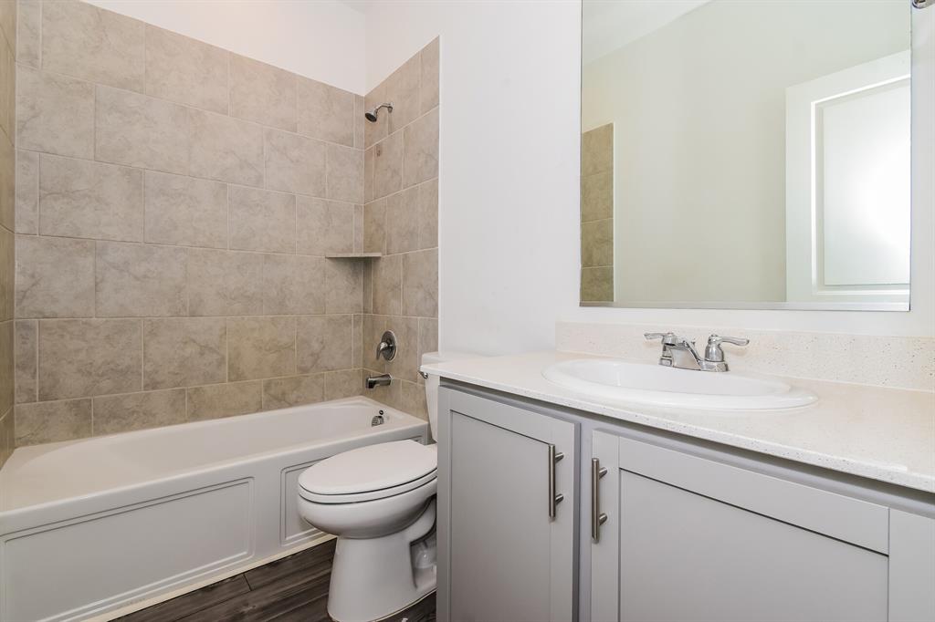 1208 Mesquite Lane Princeton, TX 75407 - Photo 14 of 17 a bathroom with a sink a toilet and a bathtub