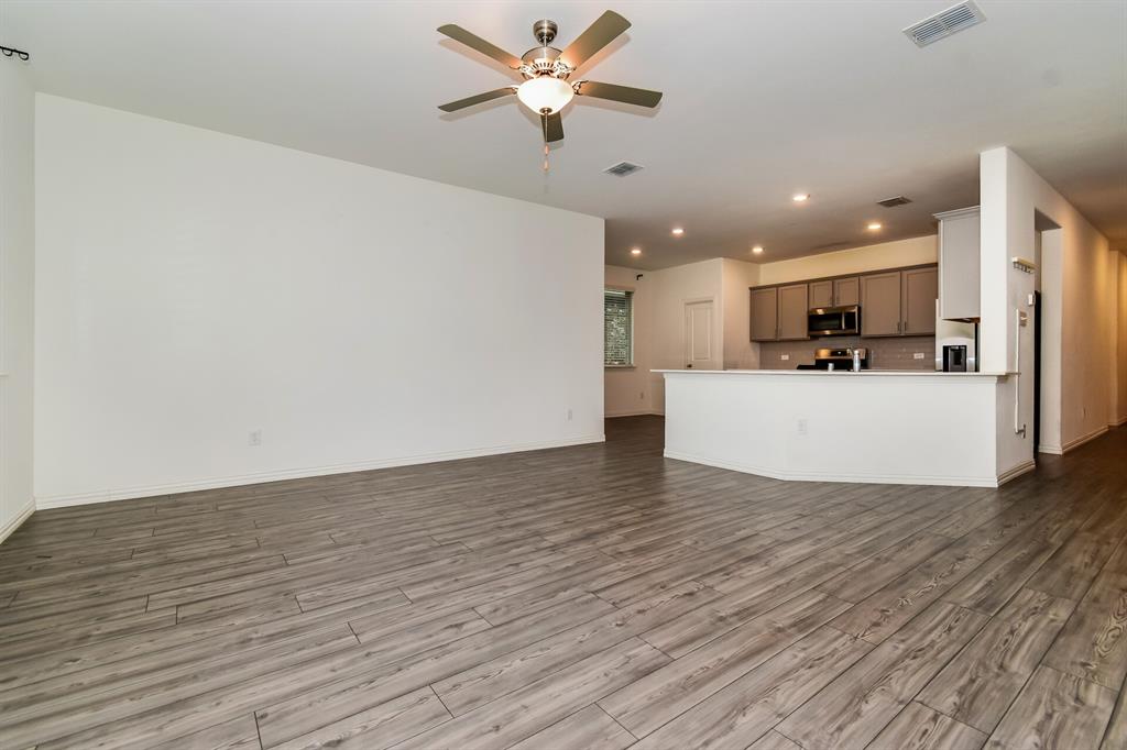 1208 Mesquite Lane Princeton, TX 75407 - Photo 3 of 17 a view of a kitchen with a sink and a refrigerator