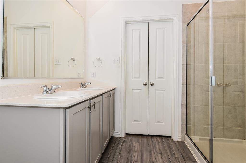 1208 Mesquite Lane Princeton, TX 75407 - Photo 9 of 17 a bathroom with a sink and mirror