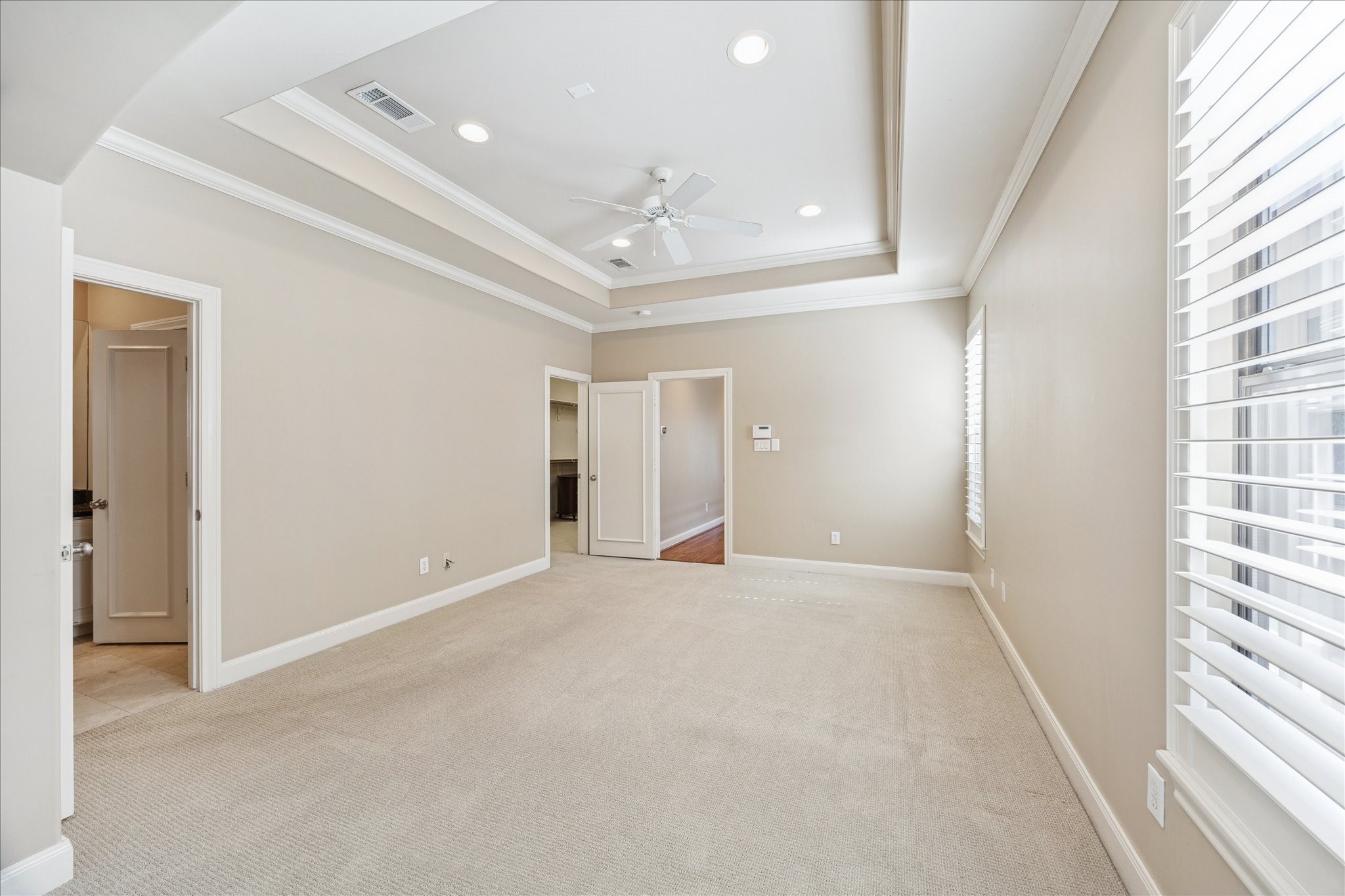 1712 McDuffie Street Houston, TX 77019 - Photo 14 of 27 wooden floor in an empty room with a window