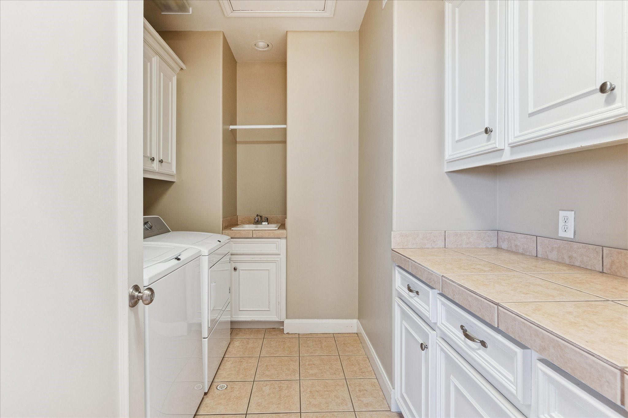 1712 McDuffie Street Houston, TX 77019 - Photo 23 of 27 a bathroom with a granite countertop sink and a mirror
