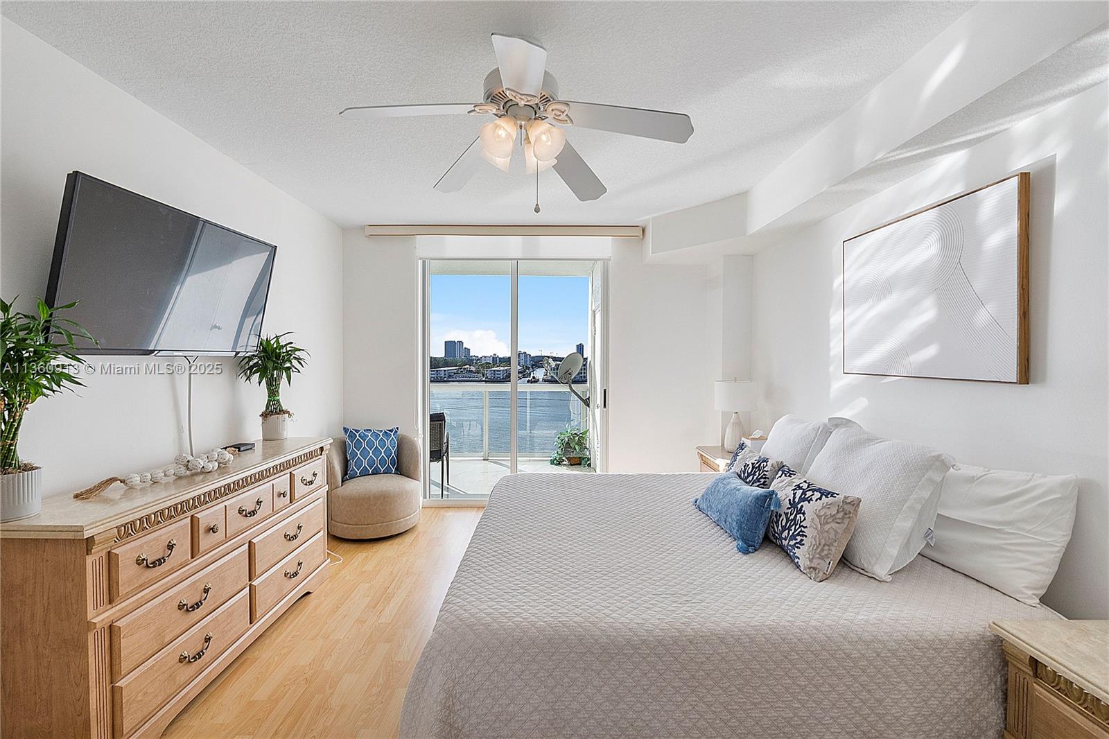 17050 North Bay Road, Unit 807 Sunny Isles Beach, FL 33160 - Photo 13 of 50 a bed room with bed and window