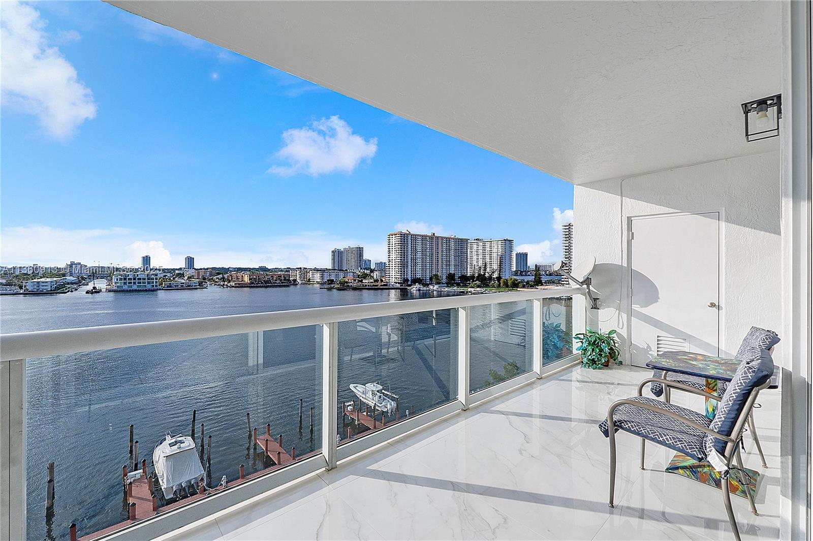 17050 North Bay Road, Unit 807 Sunny Isles Beach, FL 33160 - Photo 20 of 50 a view of a terrace with chairs