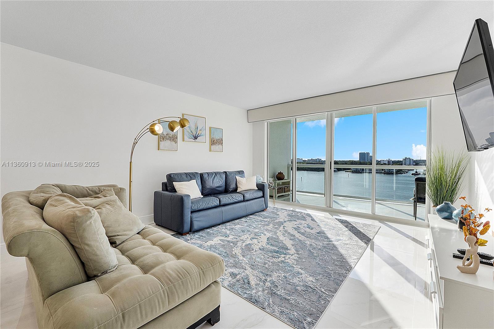 17050 North Bay Road, Unit 807 Sunny Isles Beach, FL 33160 - Photo 2 of 50 a living room with furniture