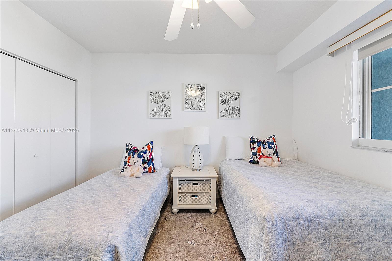 17050 North Bay Road, Unit 807 Sunny Isles Beach, FL 33160 - Photo 27 of 50 a bedroom with a bed and a window