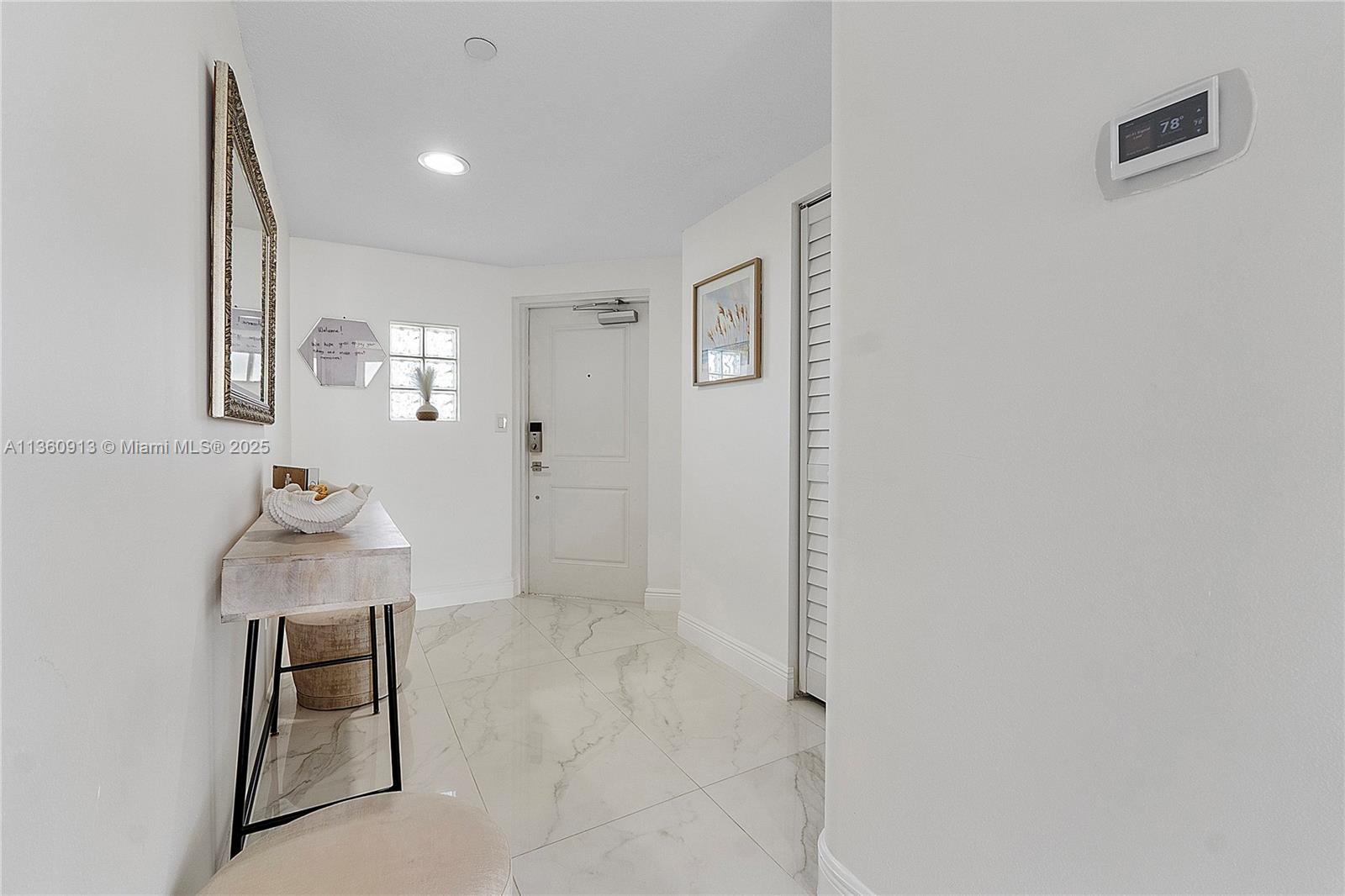 17050 North Bay Road, Unit 807 Sunny Isles Beach, FL 33160 - Photo 30 of 50 a room with painting and a table