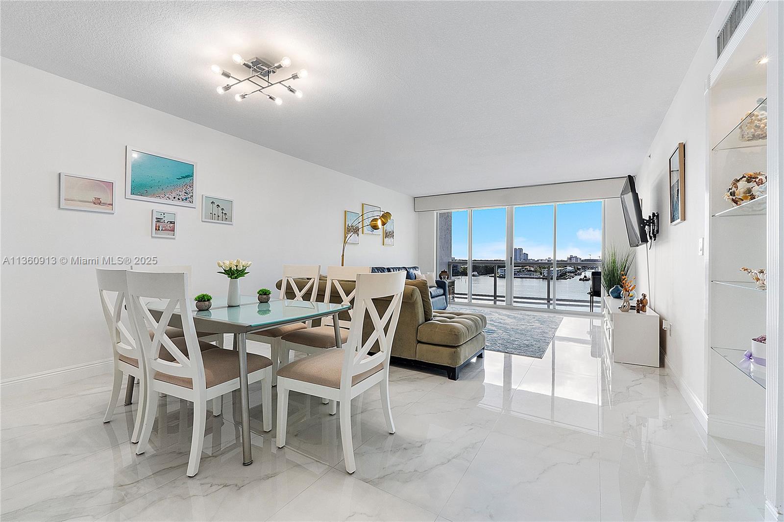 17050 North Bay Road, Unit 807 Sunny Isles Beach, FL 33160 - Photo 3 of 50 a view of a dining room kitchen and a livingroom