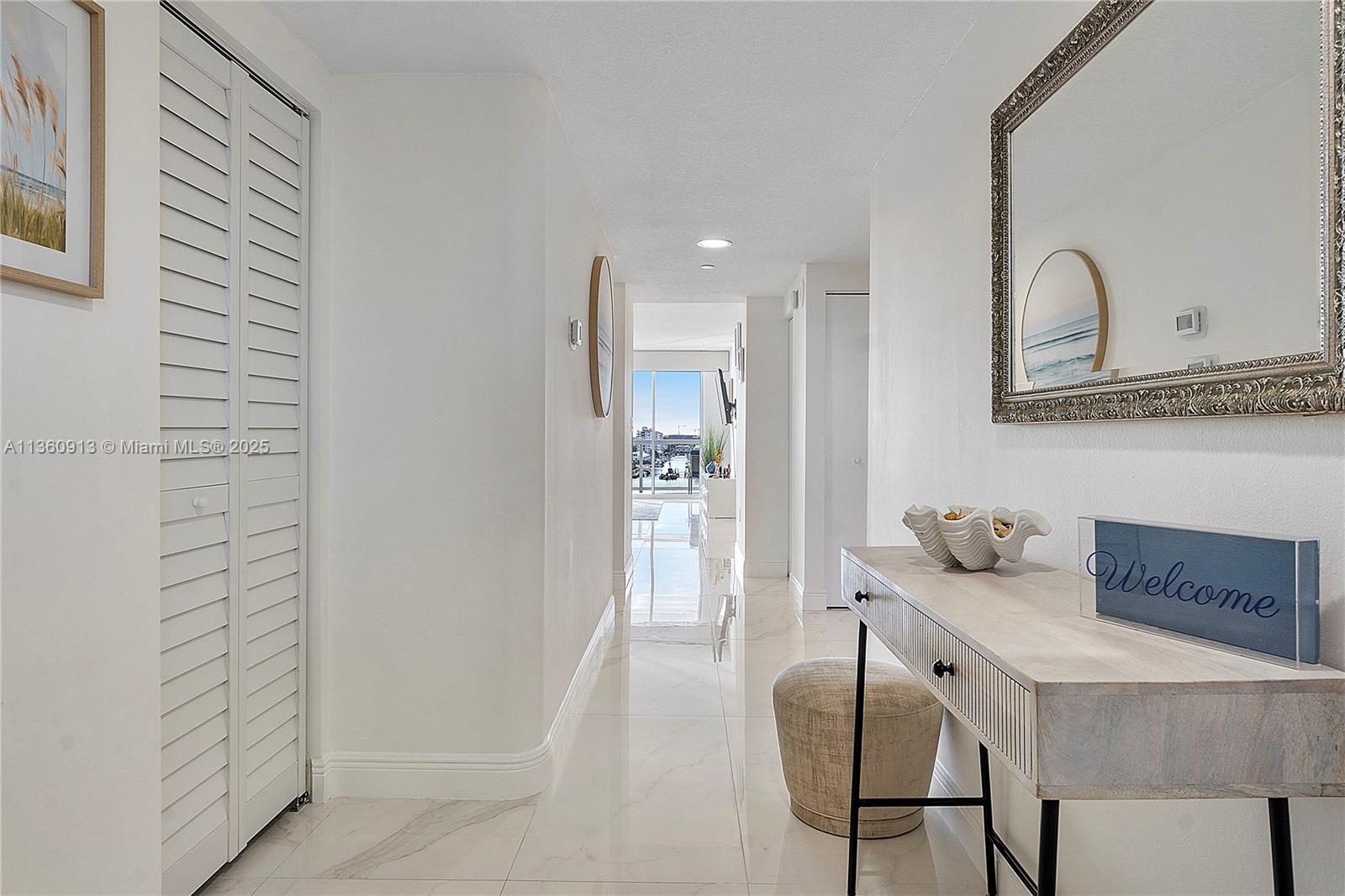 17050 North Bay Road, Unit 807 Sunny Isles Beach, FL 33160 - Photo 31 of 50 a bathroom with a granite countertop sink a mirror and shower