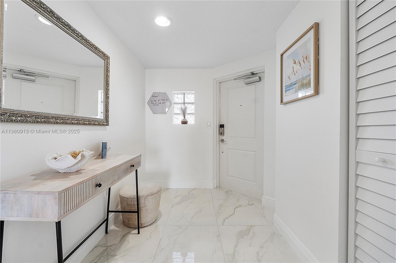 17050 North Bay Road, Unit 807 Sunny Isles Beach, FL 33160 - Photo 33 of 50 a bathroom with a sink a mirror and a shower