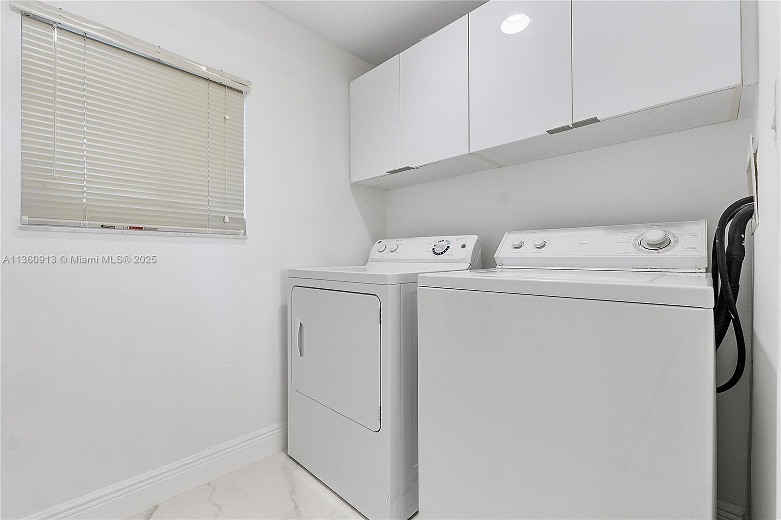 17050 North Bay Road, Unit 807 Sunny Isles Beach, FL 33160 - Photo 34 of 50 a utility room with dryer and washer