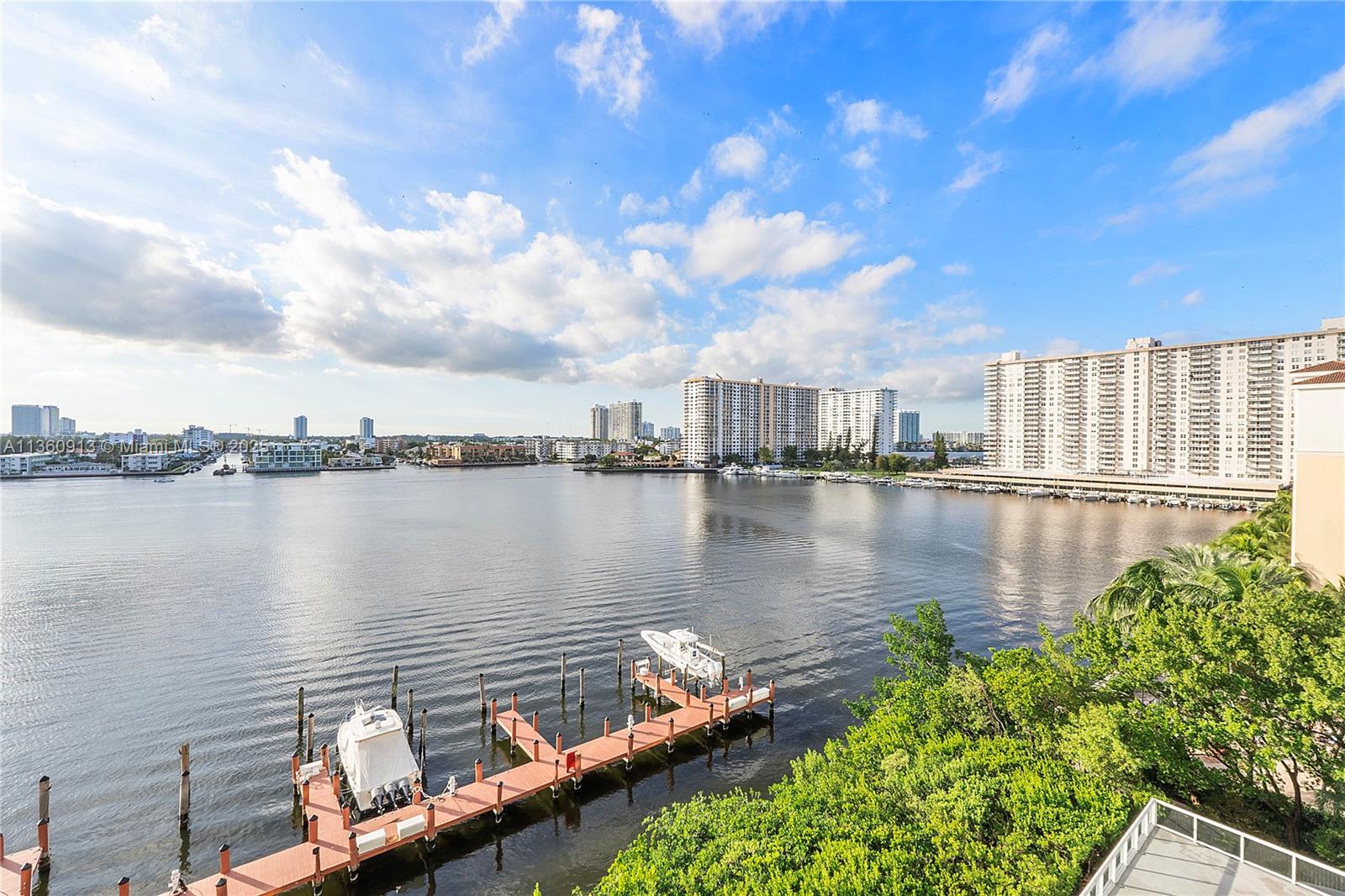 17050 North Bay Road, Unit 807 Sunny Isles Beach, FL 33160 - Photo 49 of 50 a view of a lake with a city from a lake