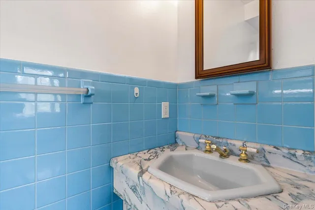 a living room with furniture a flat screen tv and a large window