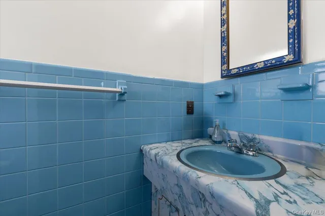 a view of a street with brick walls