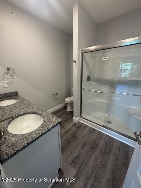 435 Circle Drive Taylor, PA 18517 - Photo 31 of 33 a bathroom with a granite countertop sink a toilet a mirror and shower