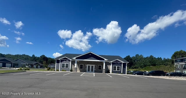 435 Circle Drive Taylor, PA 18517 - Photo 4 of 33 a front view of a house with a yard and garage