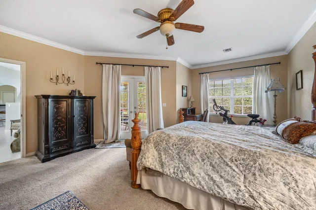 a bedroom with a bed dresser and a window