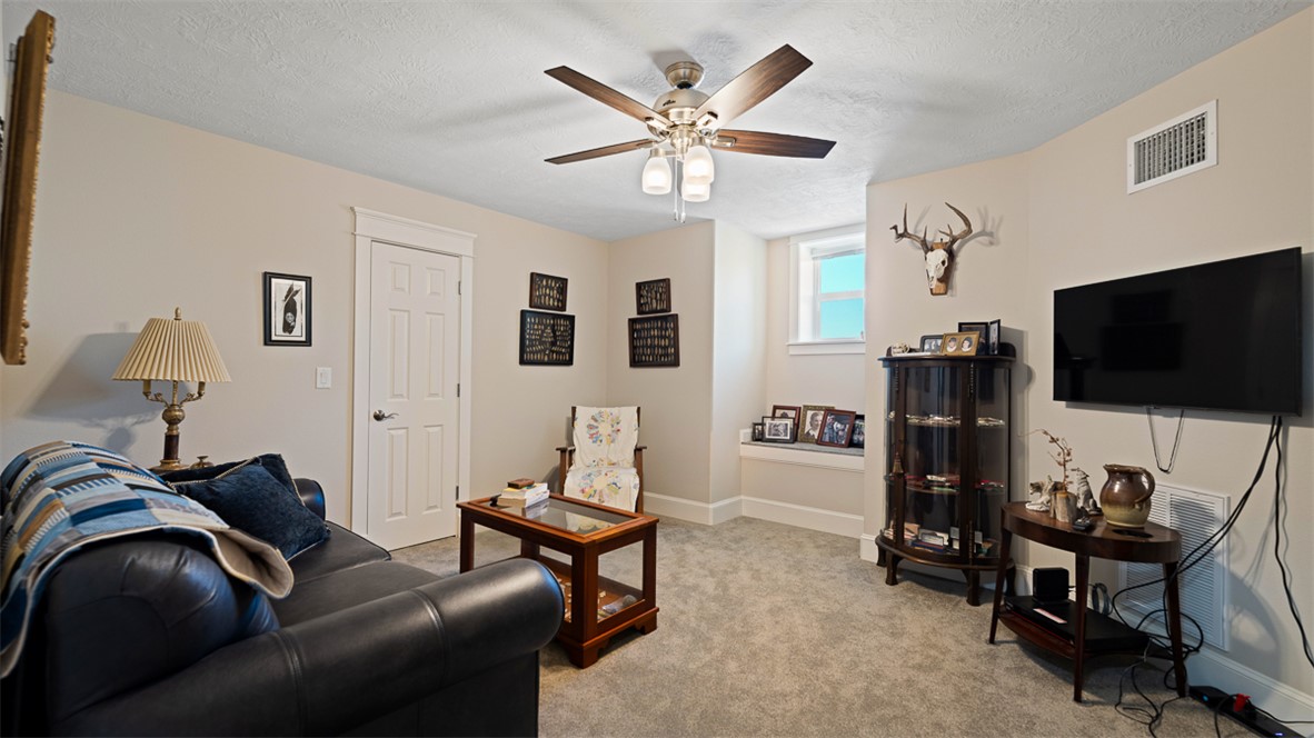 11258 Providence Road Hearne, TX 77859 - Photo 25 of 39 a living room with furniture and a flat screen tv