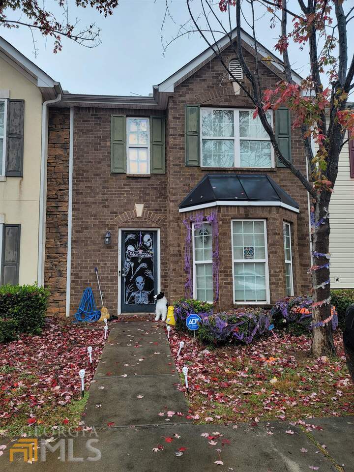 1894 Grove Way Hampton, GA 30228 - Photo 1 of 1 a front view of a house with garden