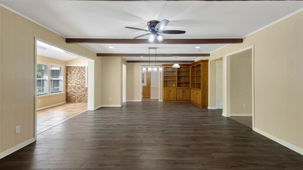 2801 Florence Street Kilgore, TX 75662 - Photo 14 of 39 a view of an empty room with wooden floor and a ceiling fan