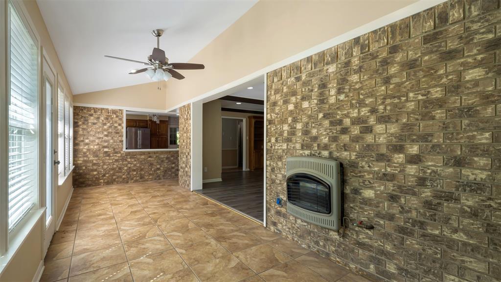 2801 Florence Street Kilgore, TX 75662 - Photo 16 of 39 a view of a livingroom with a fireplace and window