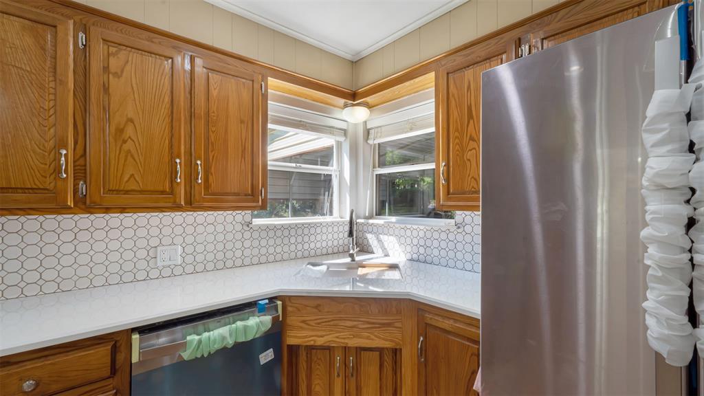 2801 Florence Street Kilgore, TX 75662 - Photo 20 of 39 a kitchen with stainless steel appliances a sink and a large window