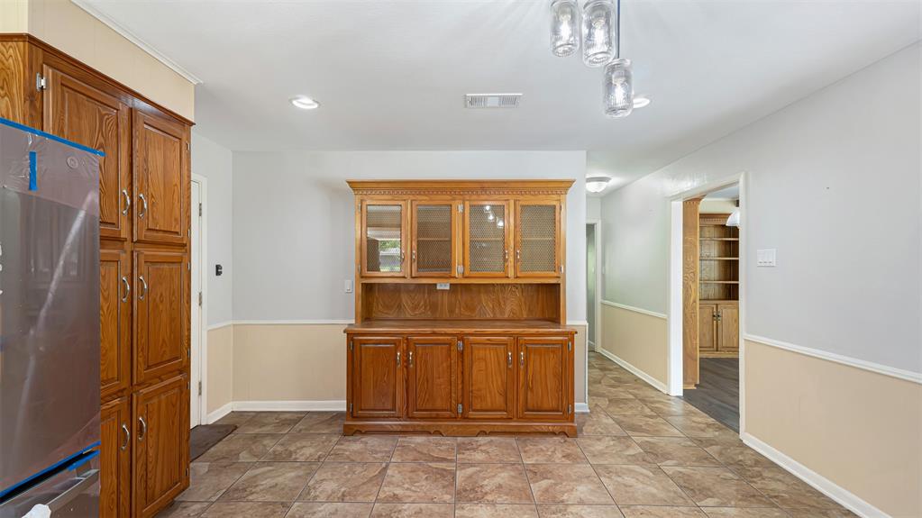 2801 Florence Street Kilgore, TX 75662 - Photo 21 of 39 a view of kitchen with windows and refrigerator