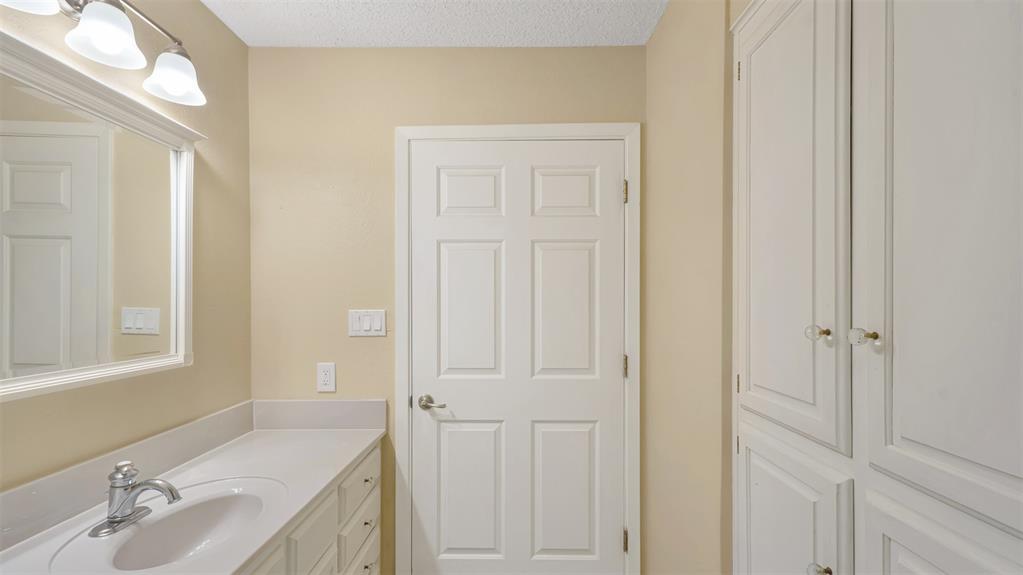 2801 Florence Street Kilgore, TX 75662 - Photo 32 of 39 a bathroom with a sink and a mirror