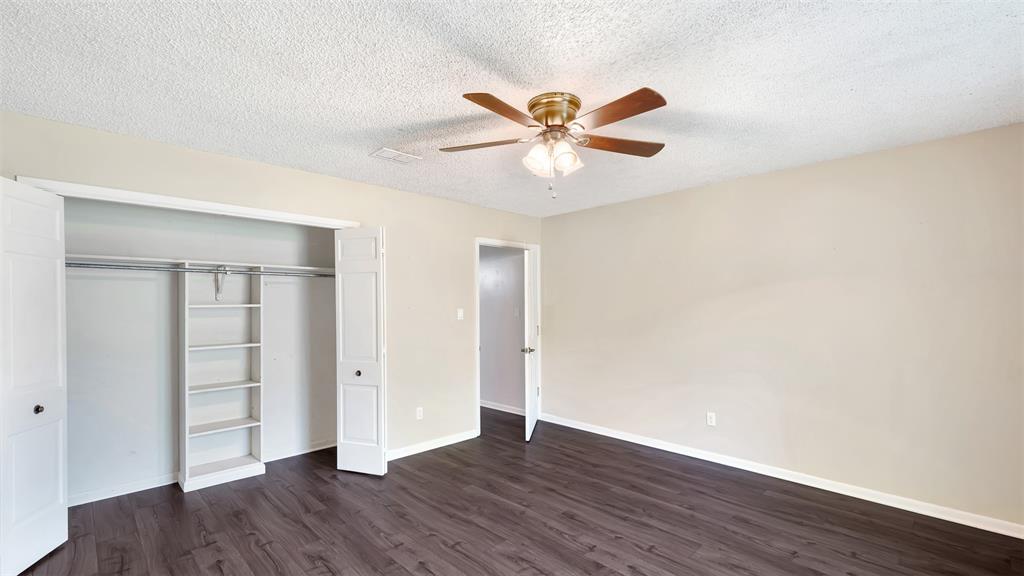 2801 Florence Street Kilgore, TX 75662 - Photo 38 of 39 a view of an empty room with wooden floor